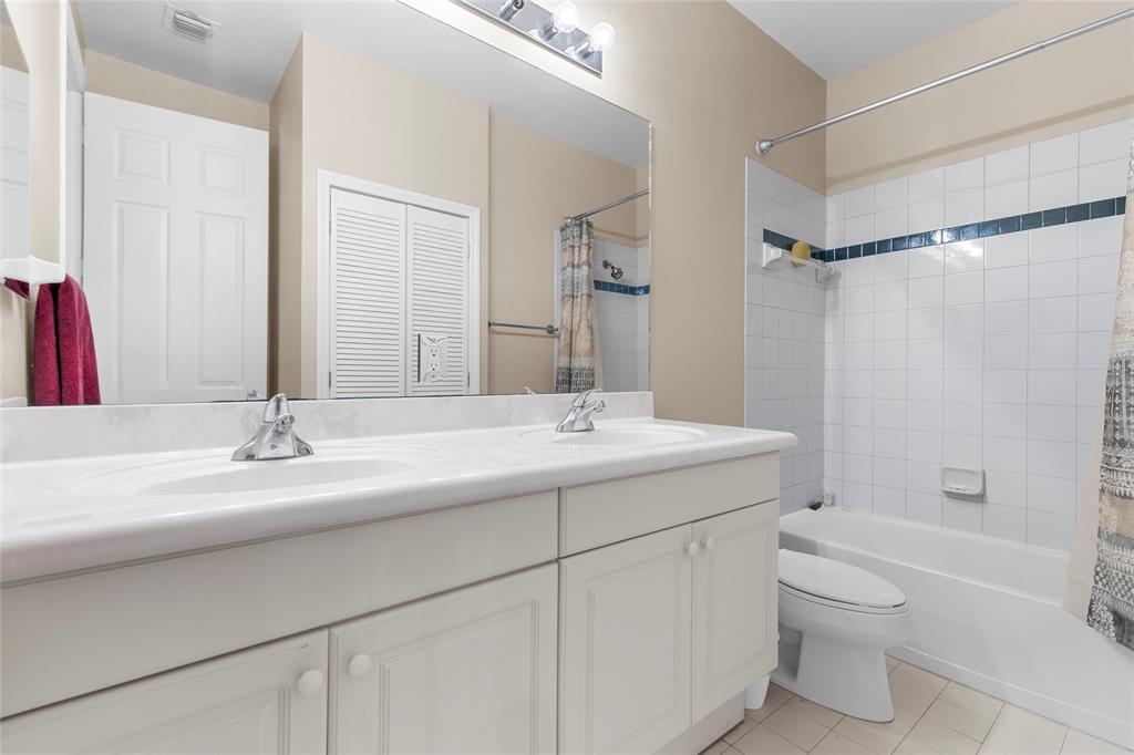 18932 Southwest 33rd Court Miramar, FL 33029 - Photo 34 of 97 a bathroom with a double vanity sink toilet mirror and shower