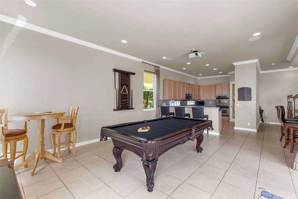 18932 Southwest 33rd Court Miramar, FL 33029 - Photo 40 of 97 a living room with furniture pool table and chairs