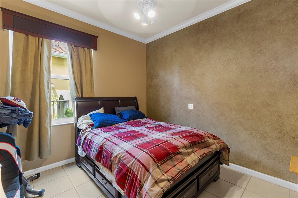 18932 Southwest 33rd Court Miramar, FL 33029 - Photo 43 of 97 a bedroom with a bed and a window