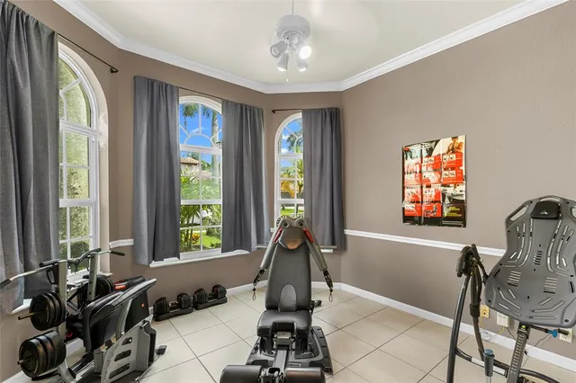 an aerial view of a city with lots of residential buildings ocean and mountain view in back