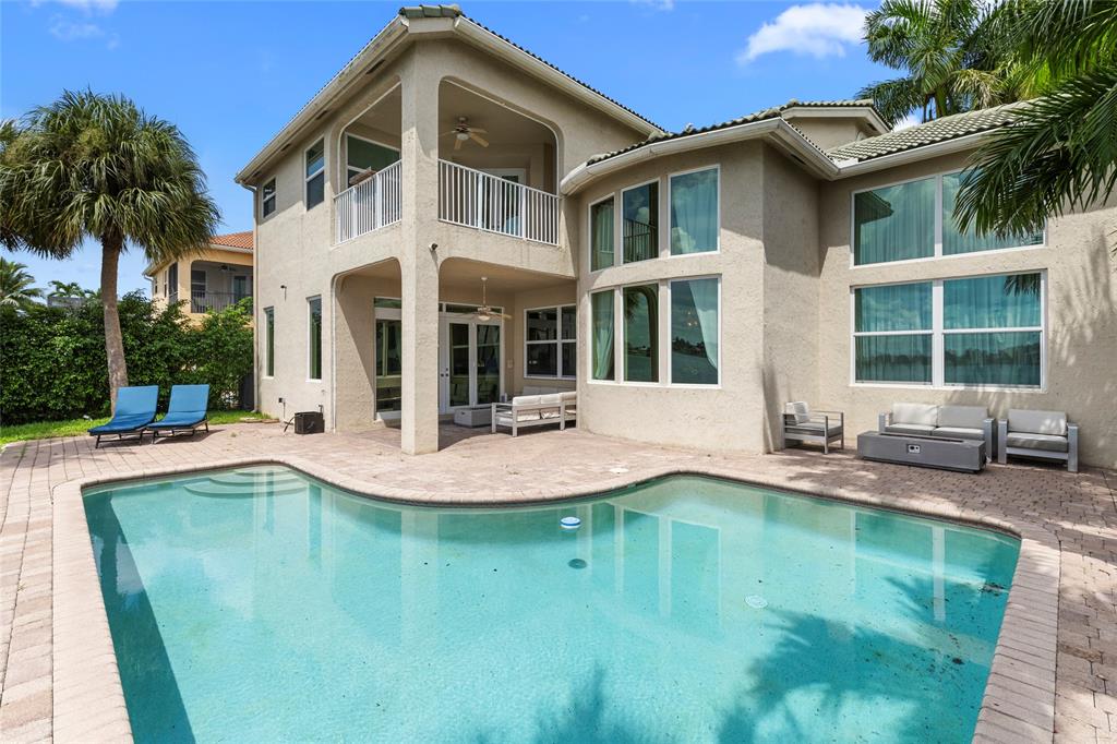 18932 Southwest 33rd Court Miramar, FL 33029 - Photo 56 of 97 a front view of a house with swimming pool and porch
