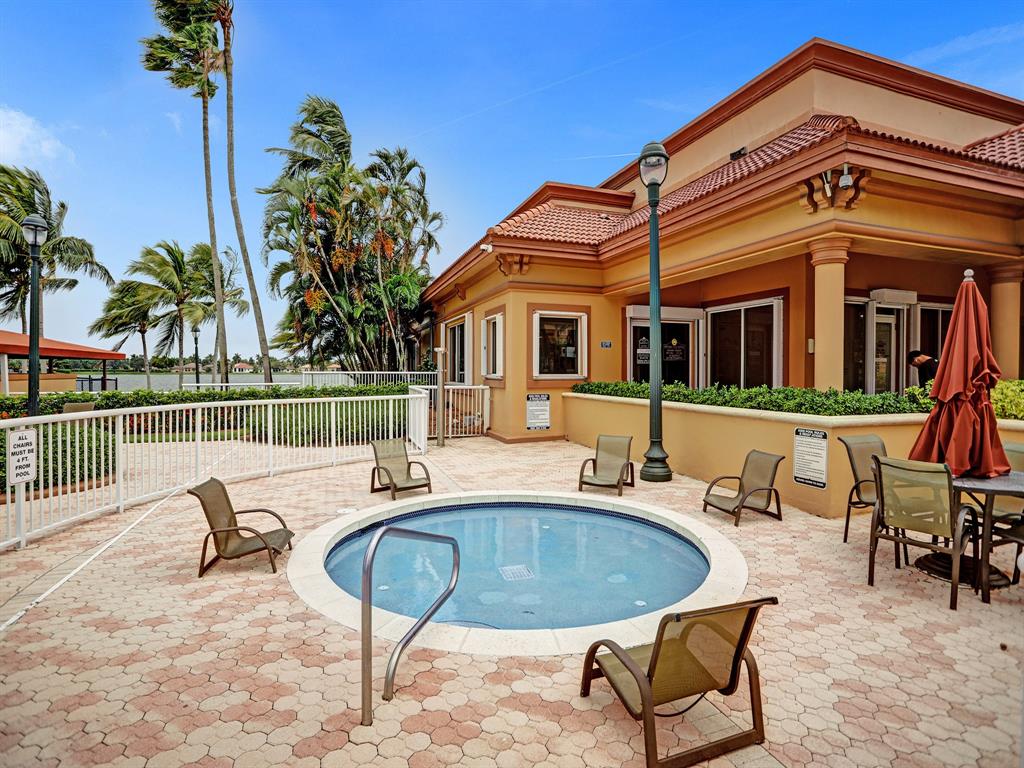 18932 Southwest 33rd Court Miramar, FL 33029 - Photo 83 of 97 a view of a white house with swimming pool and sitting area