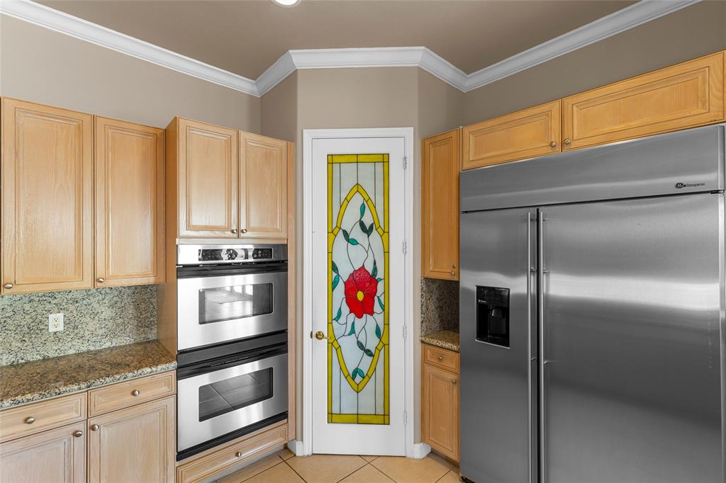 18932 Southwest 33rd Court Miramar, FL 33029 - Photo 10 of 97 a kitchen with stainless steel appliances granite countertop a refrigerator and a sink