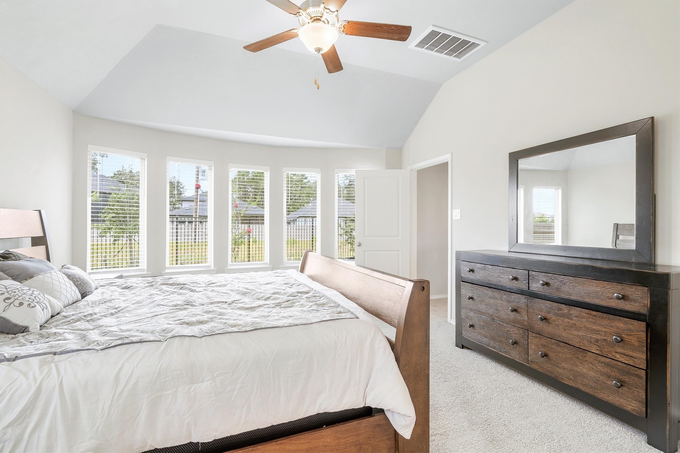 17270 Wild Watermelon Way Conroe, TX 77302 - Photo 14 of 28 The primary bedroom is the kind of room you look forward to coming back to, with plenty of room for a full dresser setup too.