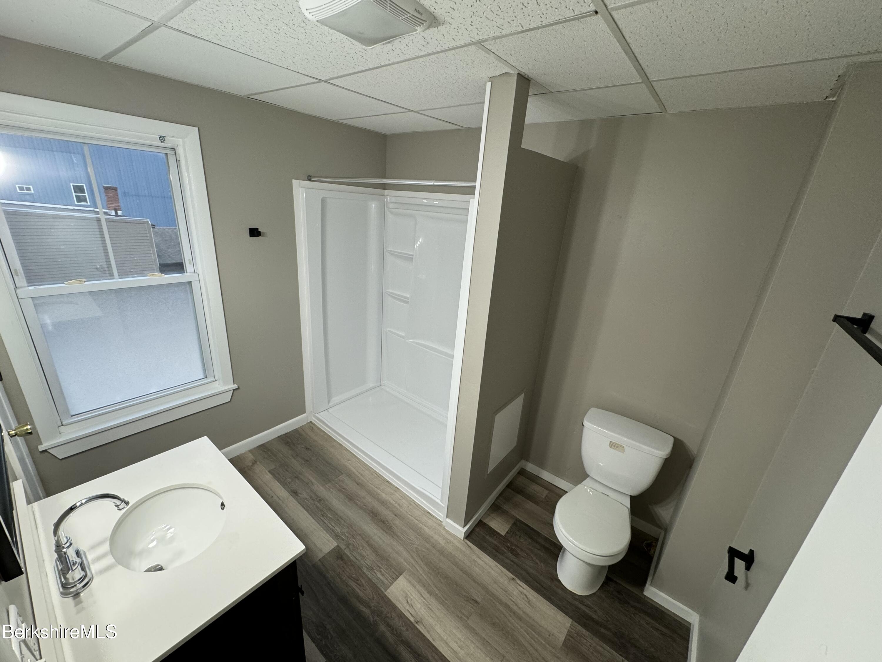 84 Summer Street, Unit B Adams, MA 01220 - Photo 3 of 8 a bathroom with a sink and a mirror