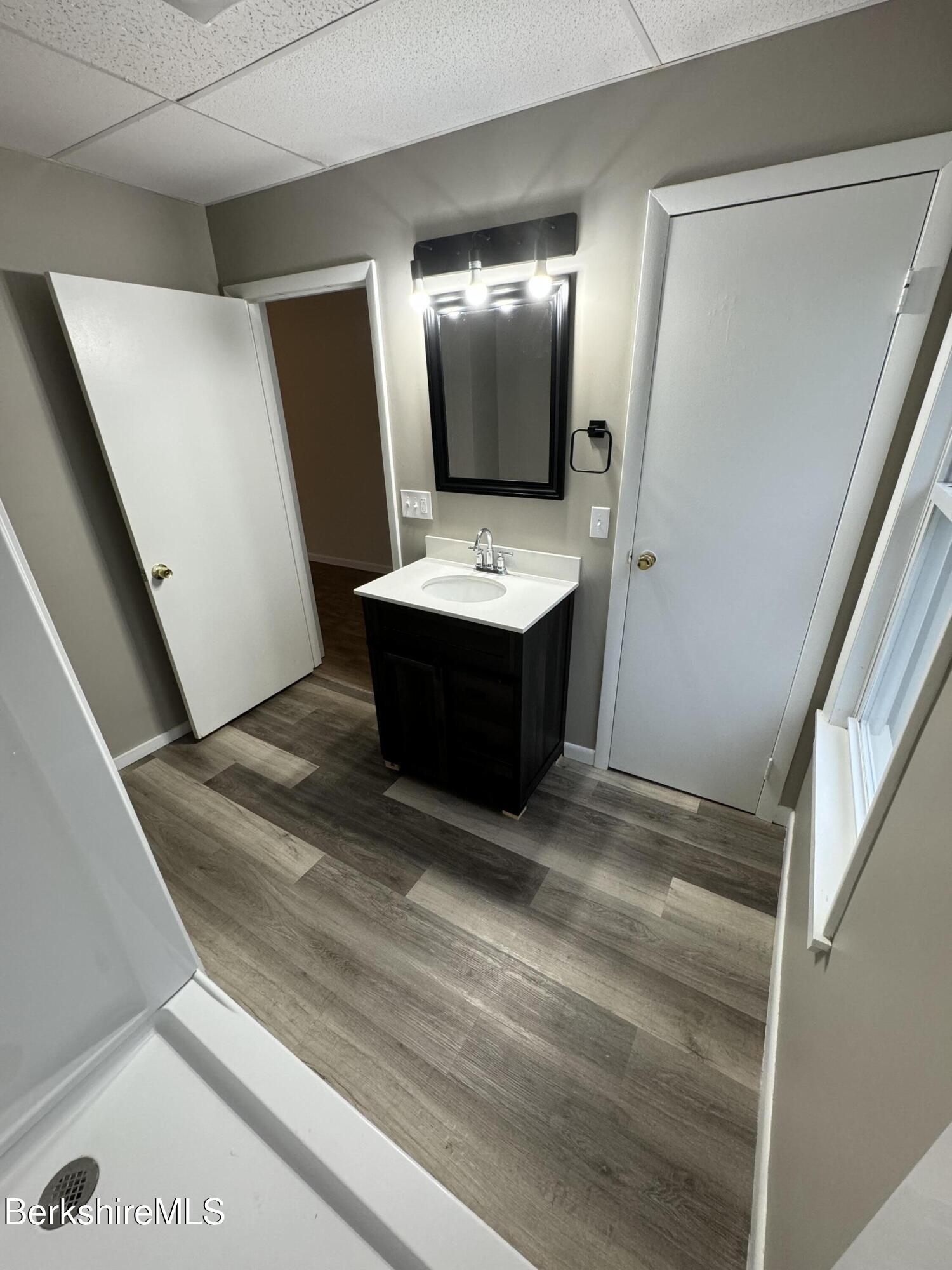 84 Summer Street, Unit B Adams, MA 01220 - Photo 4 of 8 a bathroom with a sink and mirror
