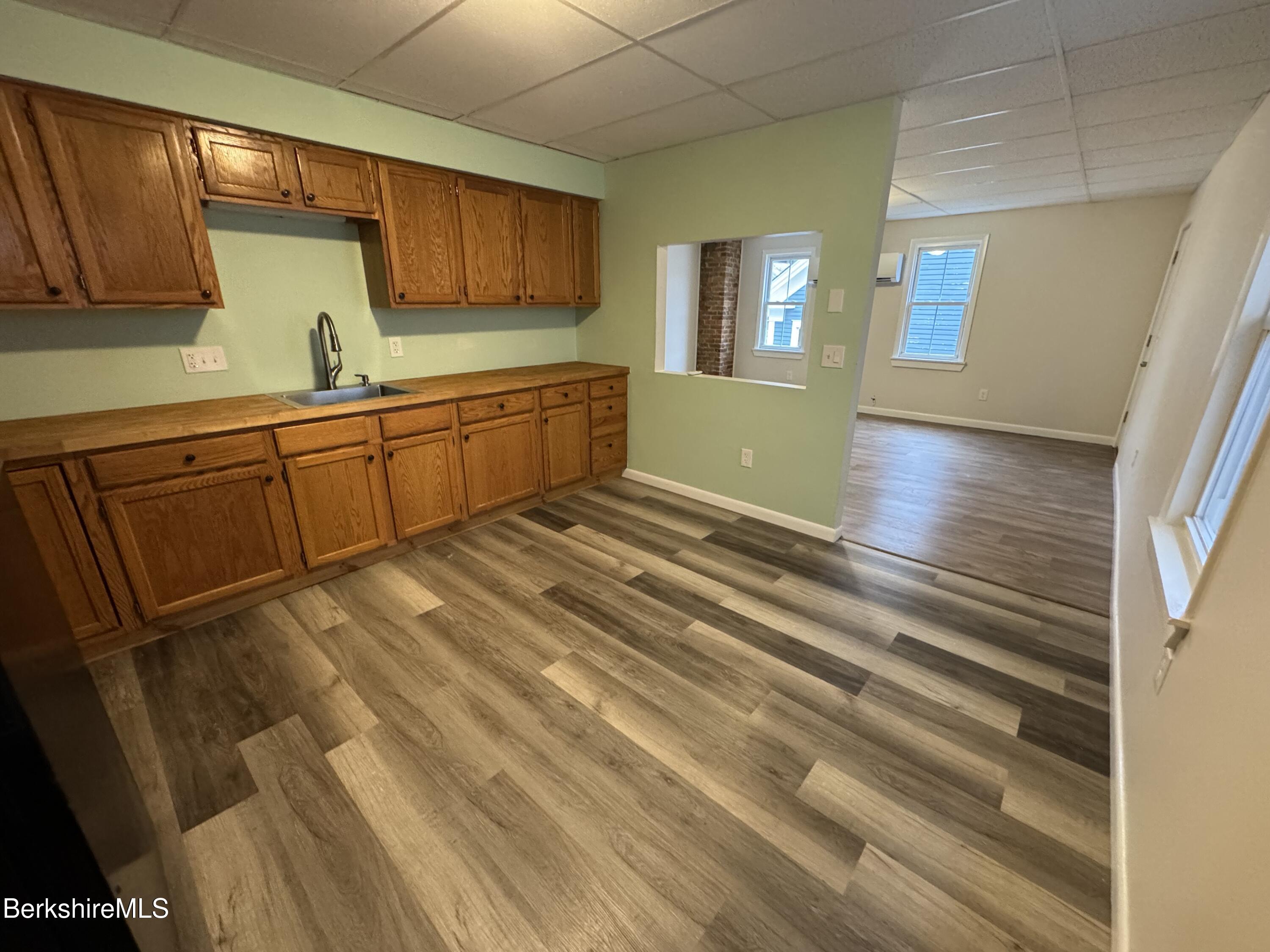 84 Summer Street, Unit B Adams, MA 01220 - Photo 8 of 8 a kitchen with stainless steel appliances granite countertop a sink and cabinets