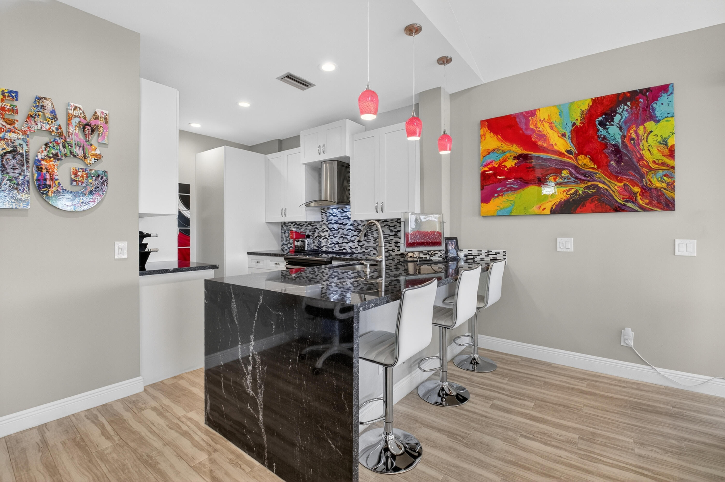19407 Sabal Lake Drive, Unit 5016 Boca Raton, FL 33434 - Photo 12 of 97 a view of a workspace with furniture and wooden floor
