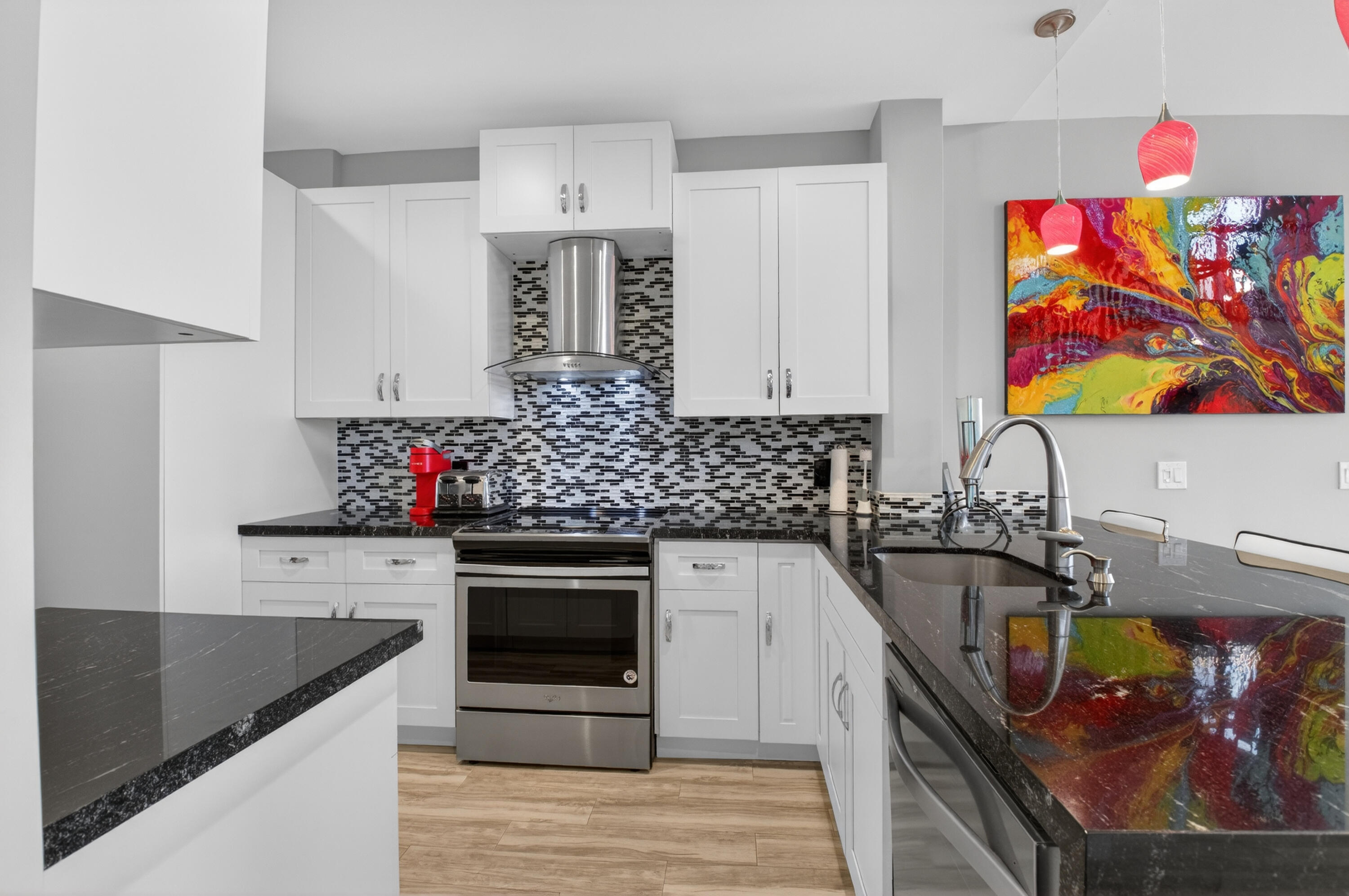 19407 Sabal Lake Drive, Unit 5016 Boca Raton, FL 33434 - Photo 13 of 97 a kitchen with stainless steel appliances granite countertop a sink stove and refrigerator