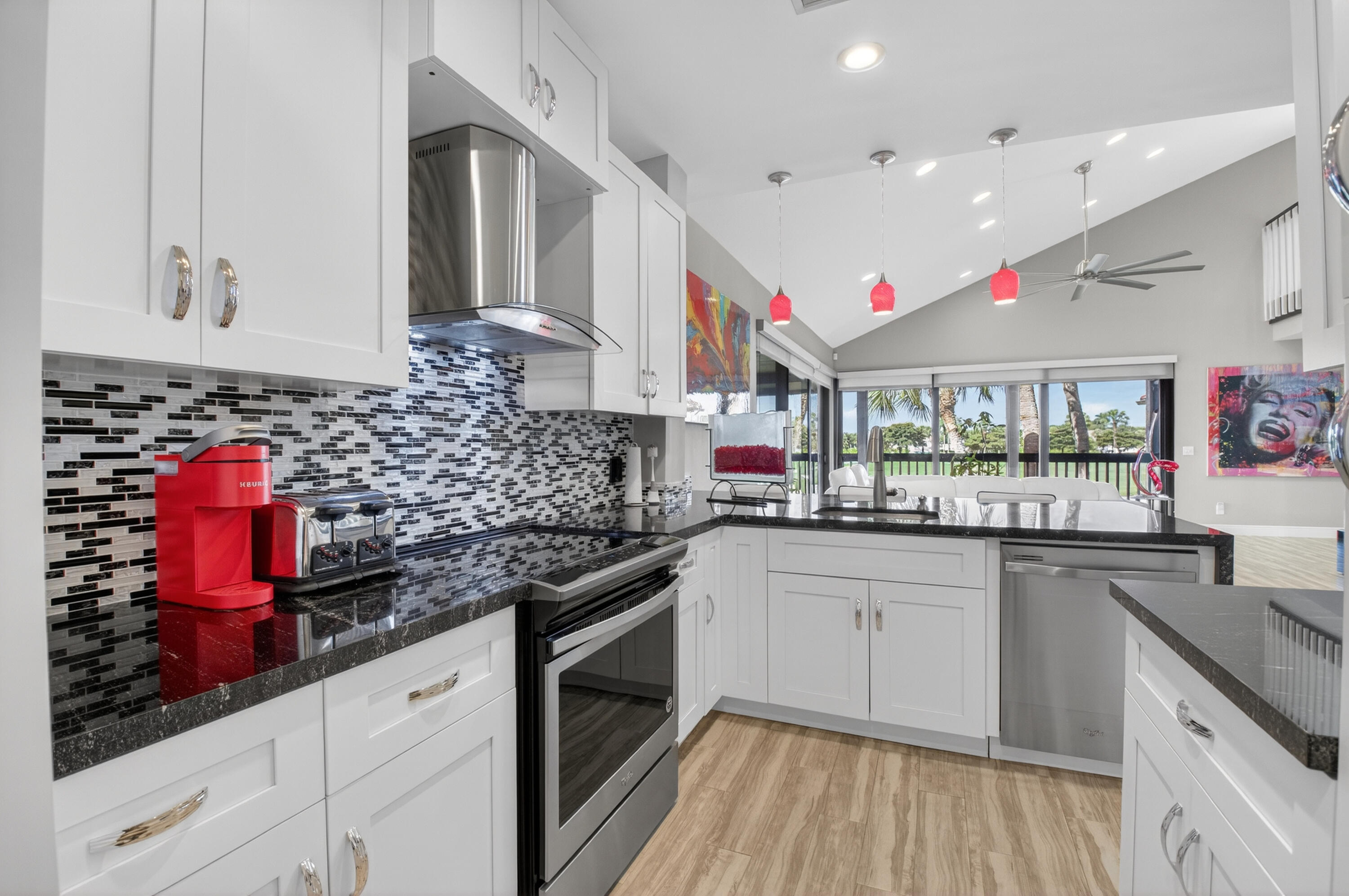 19407 Sabal Lake Drive, Unit 5016 Boca Raton, FL 33434 - Photo 14 of 97 a kitchen with granite countertop a sink stainless steel appliances and cabinets