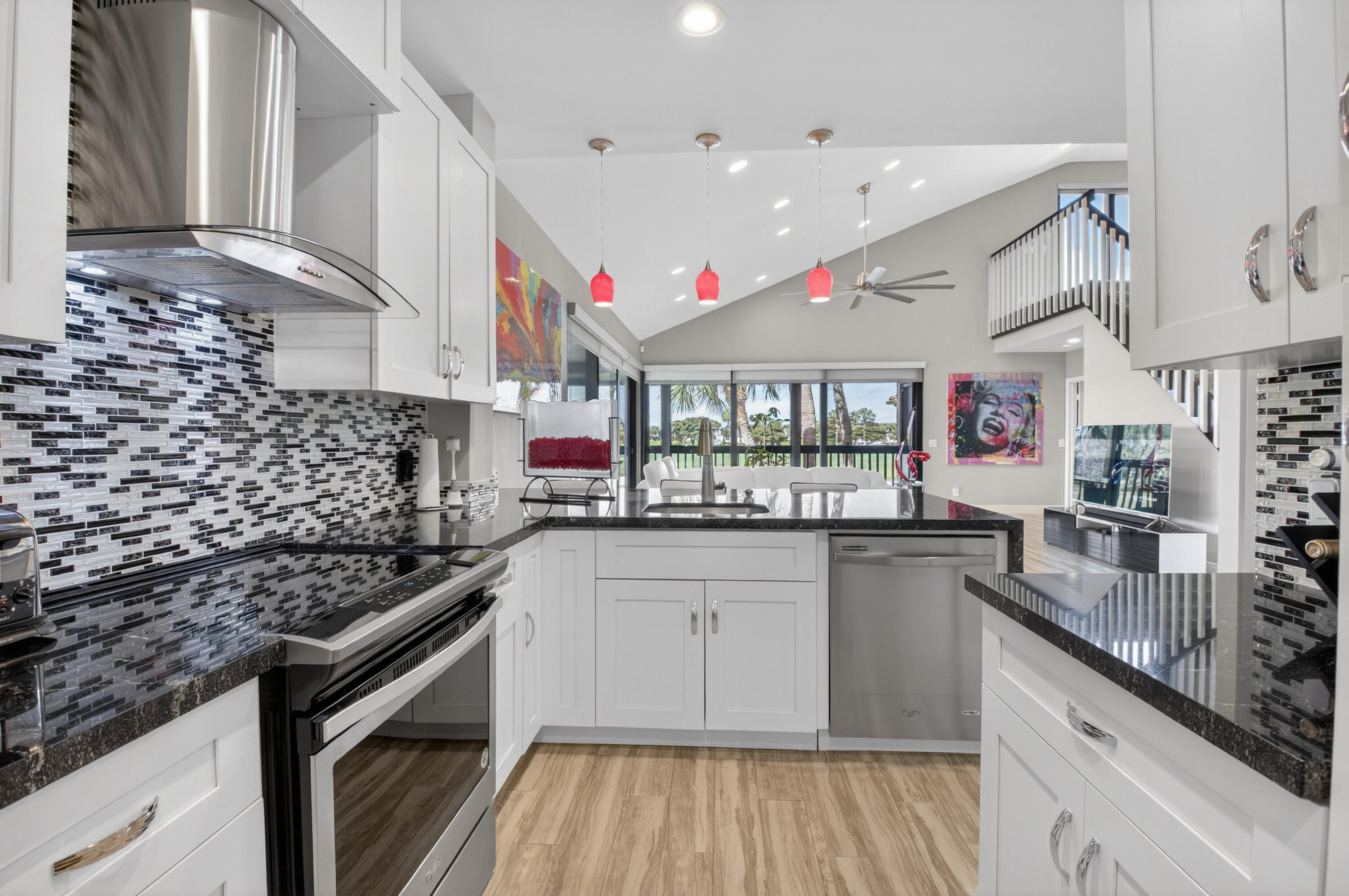 19407 Sabal Lake Drive, Unit 5016 Boca Raton, FL 33434 - Photo 15 of 97 a kitchen with stainless steel appliances granite countertop a sink stove and cabinets
