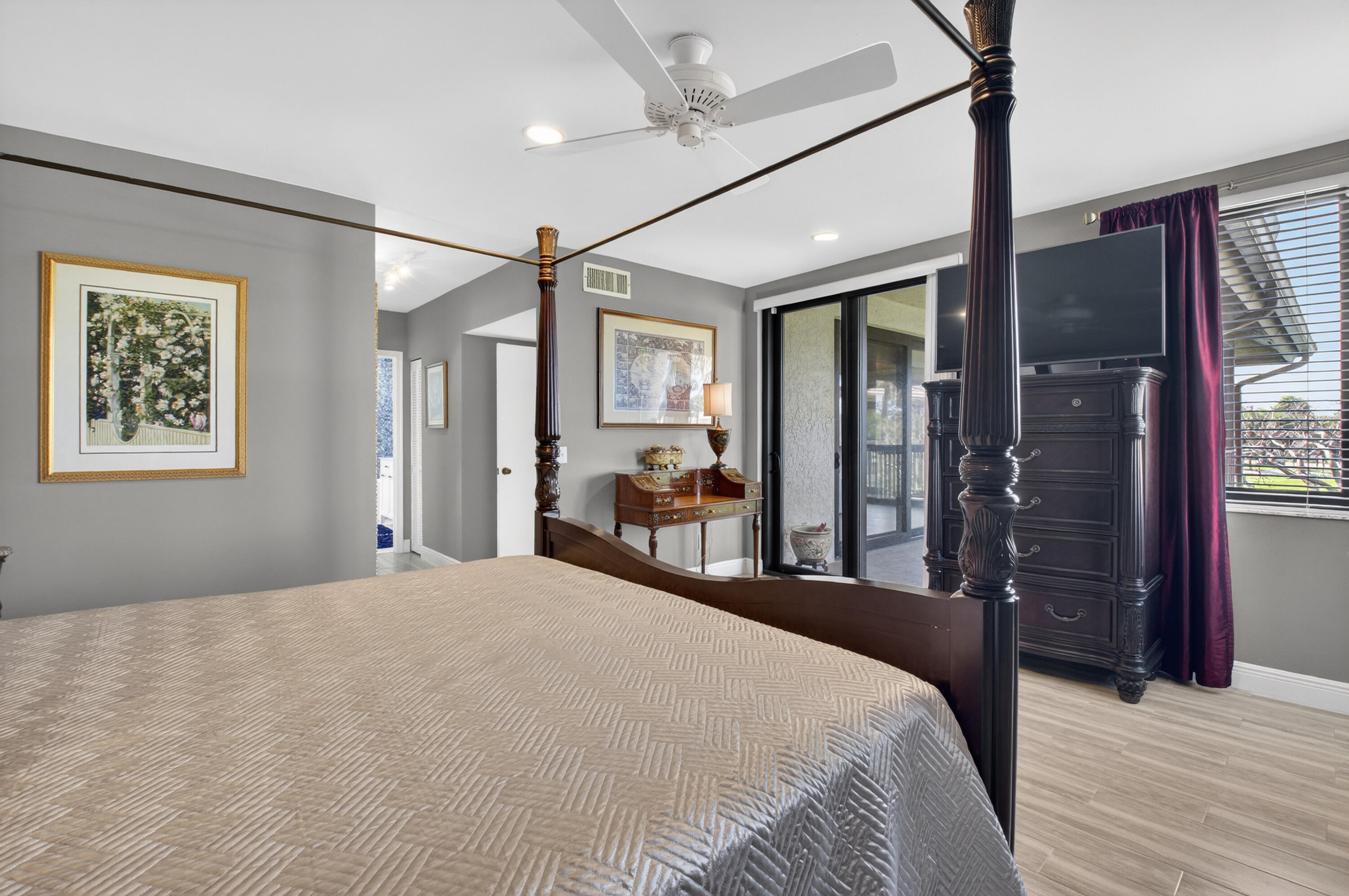 19407 Sabal Lake Drive, Unit 5016 Boca Raton, FL 33434 - Photo 20 of 97 a bedroom with a large bed and a large mirror