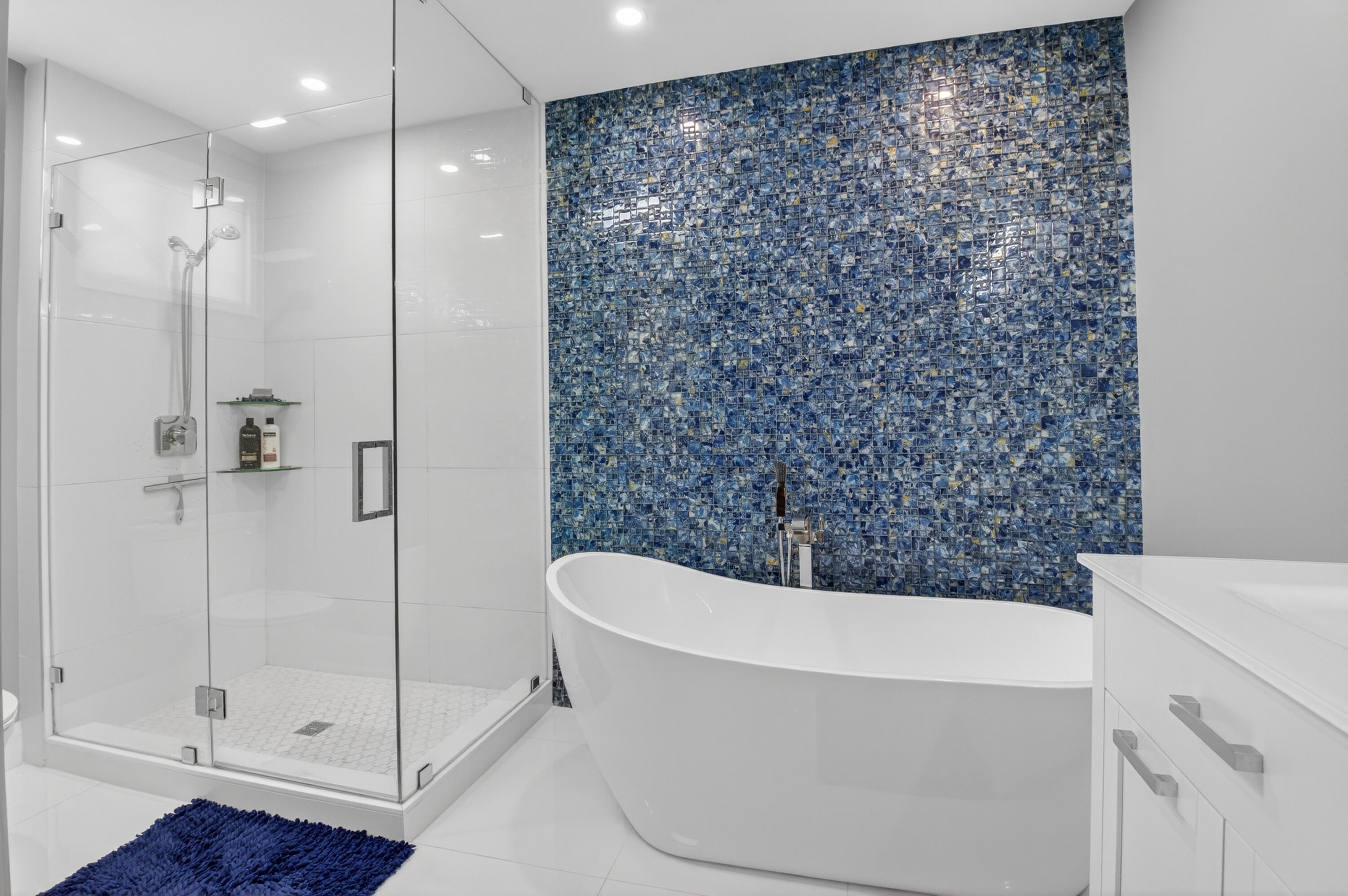 19407 Sabal Lake Drive, Unit 5016 Boca Raton, FL 33434 - Photo 23 of 97 a bathroom with a bathtub and a shower