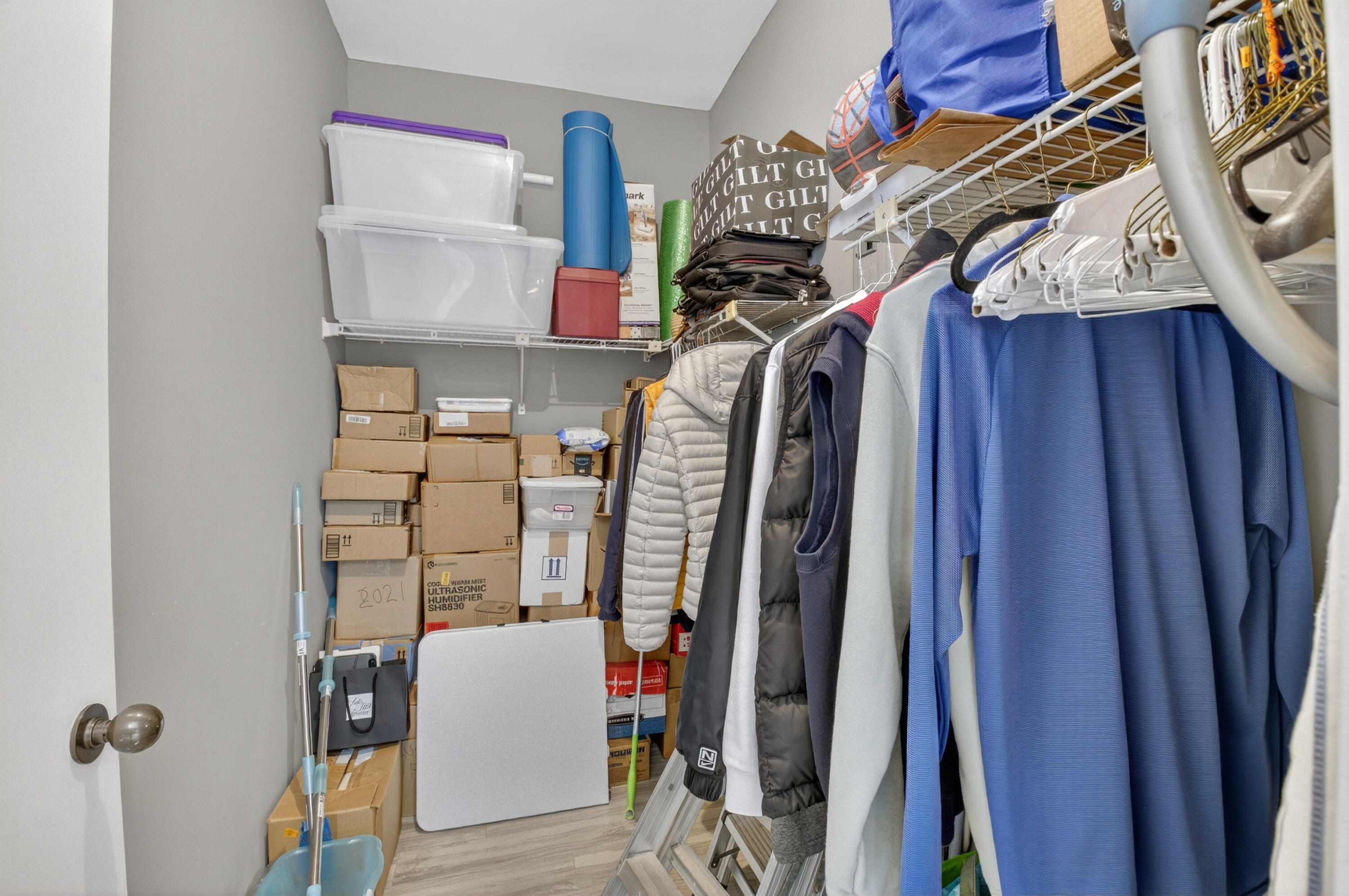 19407 Sabal Lake Drive, Unit 5016 Boca Raton, FL 33434 - Photo 26 of 97 a view of walk in closet with clothes and shoes