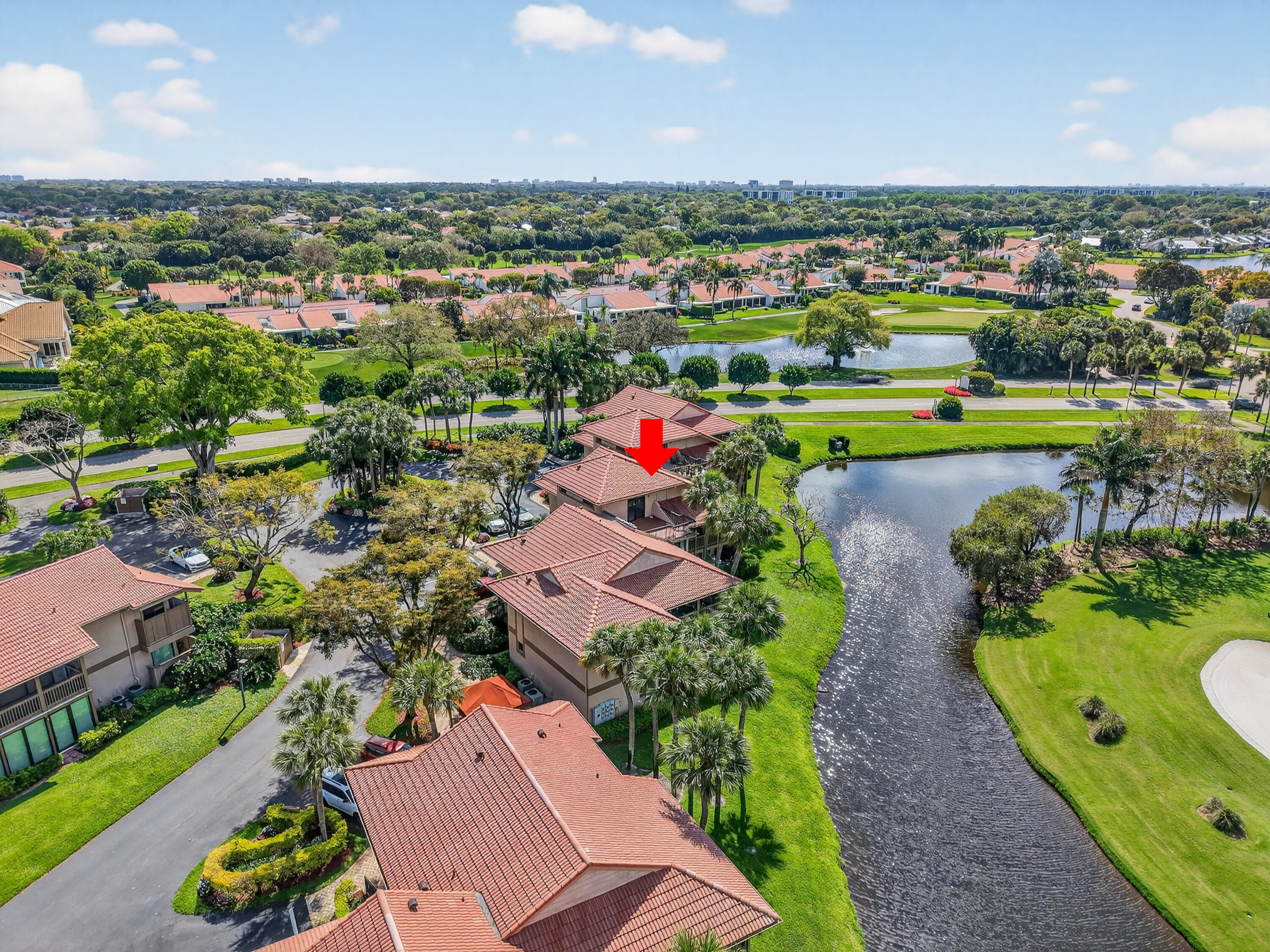 19407 Sabal Lake Drive, Unit 5016 Boca Raton, FL 33434 - Photo 47 of 97 an aerial view of a house with a garden and lake view