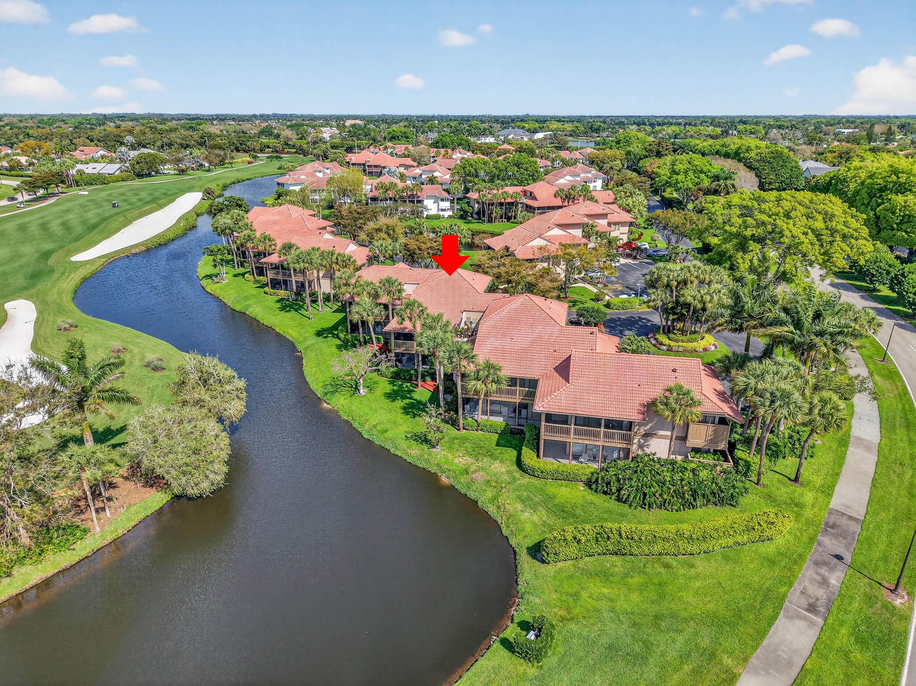 19407 Sabal Lake Drive, Unit 5016 Boca Raton, FL 33434 - Photo 52 of 97 an aerial view of a house with a garden and lake view
