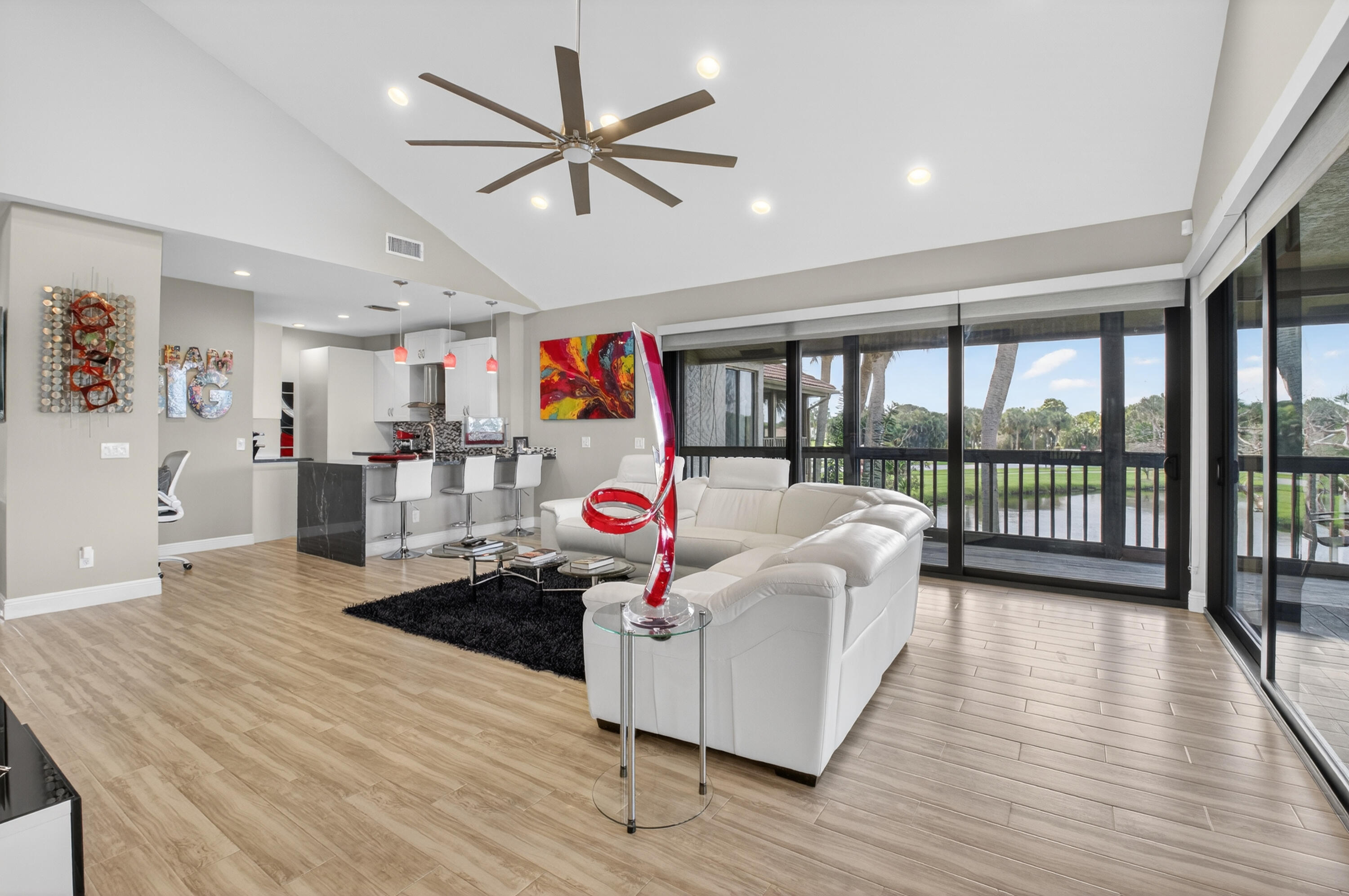 19407 Sabal Lake Drive, Unit 5016 Boca Raton, FL 33434 - Photo 9 of 97 a living room with furniture kitchen and a large window