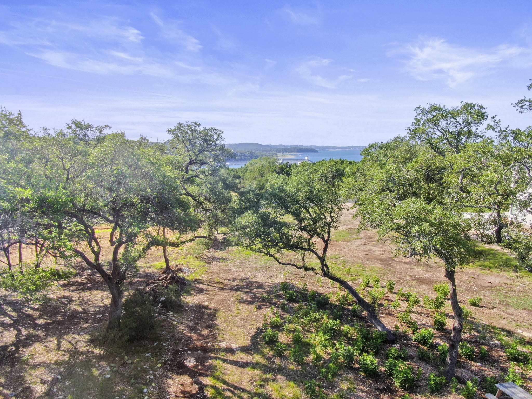 8200 Moon Rise Trail Jonestown, TX 78645 - Photo 13 of 14 a backyard of a house with lots of green space