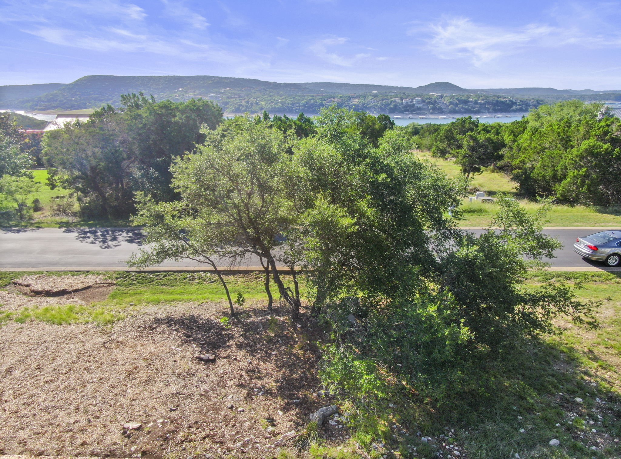 8200 Moon Rise Trail Jonestown, TX 78645 - Photo 5 of 14 a view of a lake with a mountain in the background