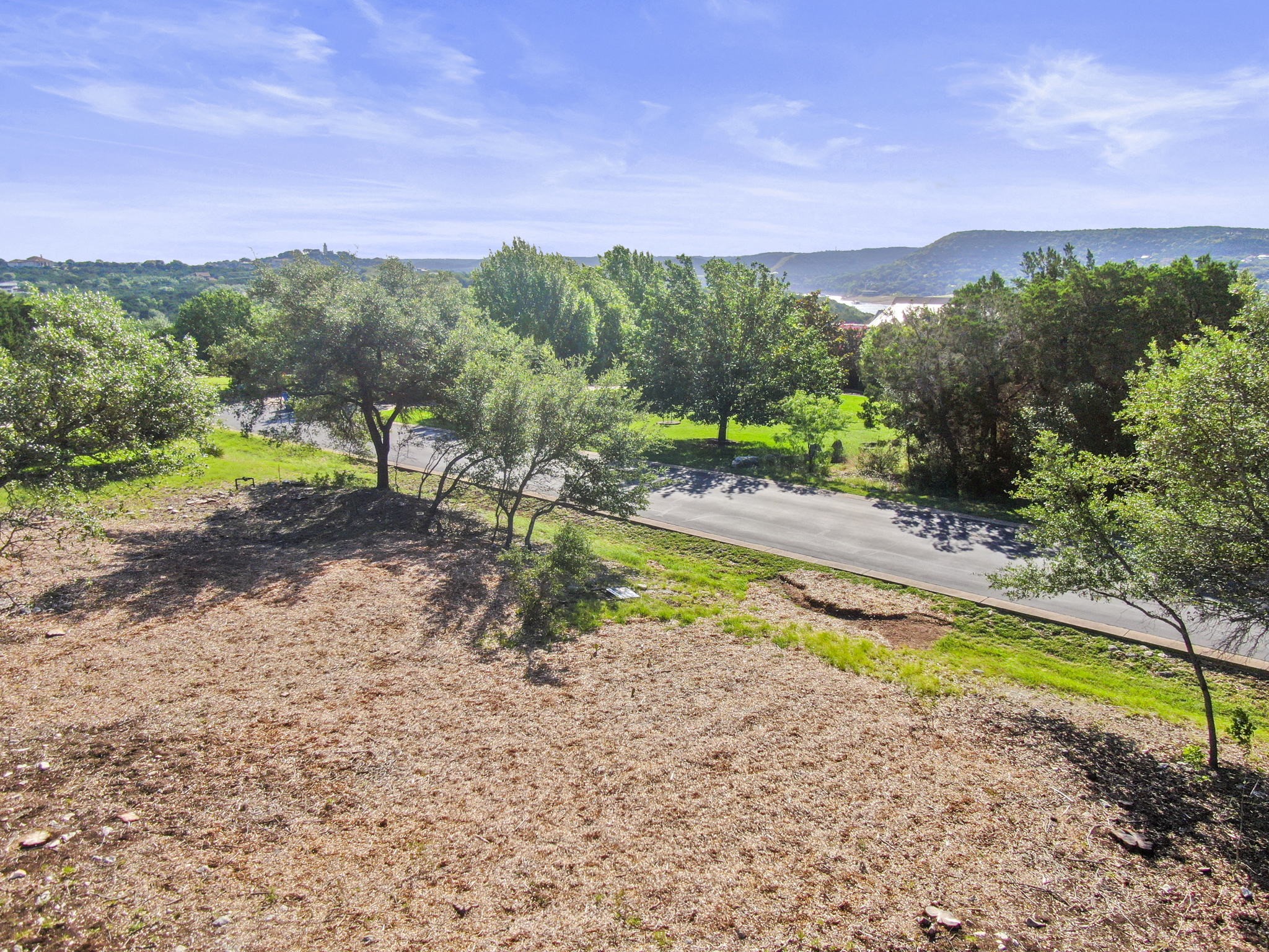 8200 Moon Rise Trail Jonestown, TX 78645 - Photo 9 of 14 a view of a house with a yard and lake view
