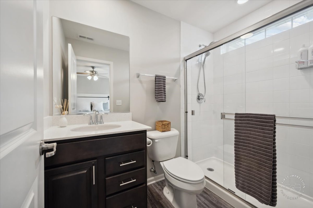 2045 Stuttle Road Batavia, IL 60510 - Photo 14 of 20 a bathroom with a sink toilet and shower