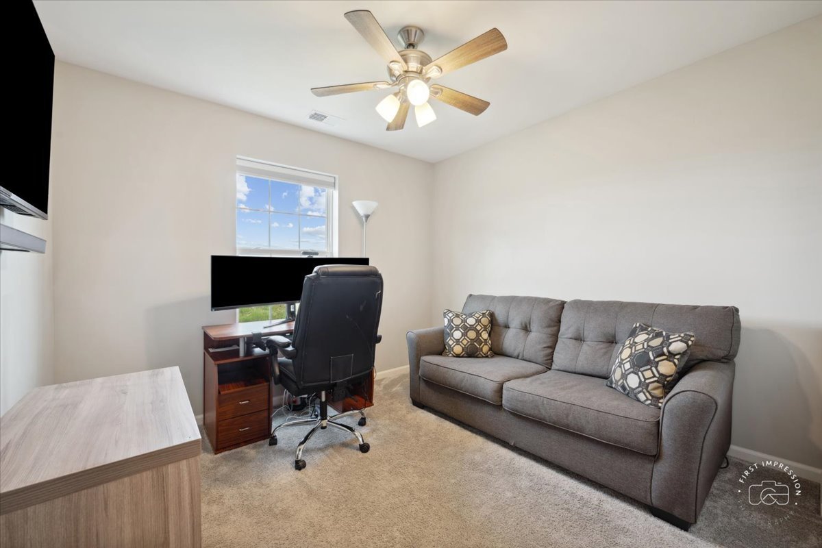 2045 Stuttle Road Batavia, IL 60510 - Photo 16 of 20 a living room with furniture and a flat screen tv