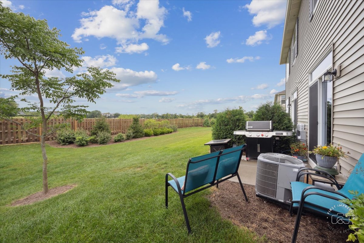2045 Stuttle Road Batavia, IL 60510 - Photo 19 of 20 a view of a patio with table and chairs and potted plants