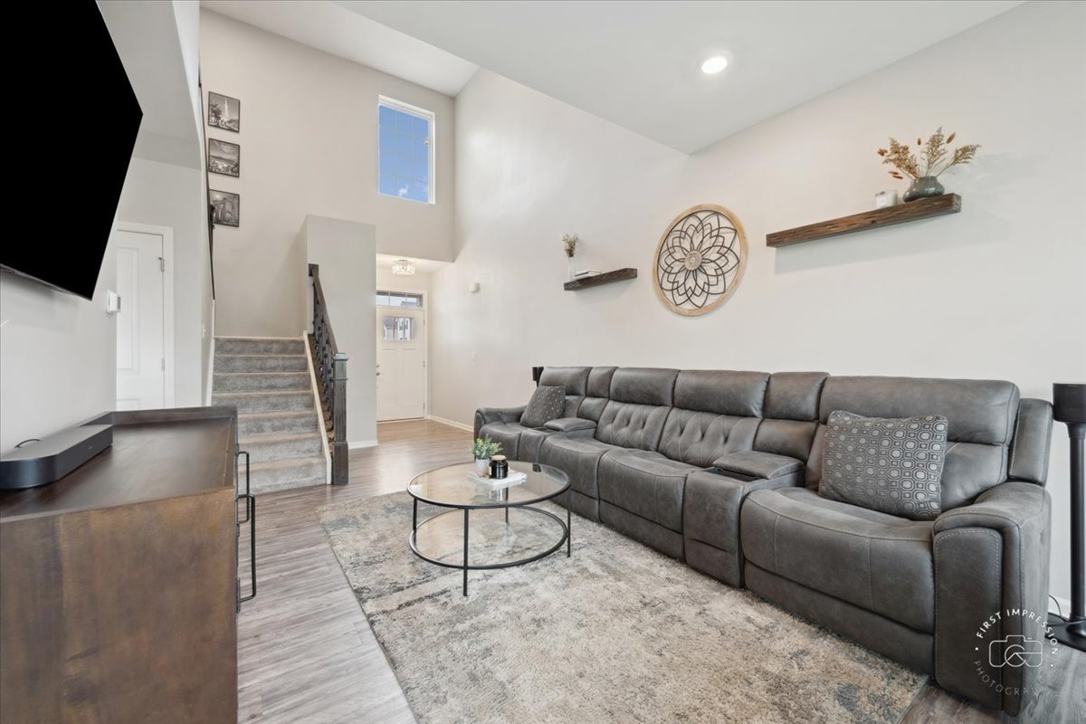 2045 Stuttle Road Batavia, IL 60510 - Photo 5 of 20 a living room with furniture and a flat screen tv