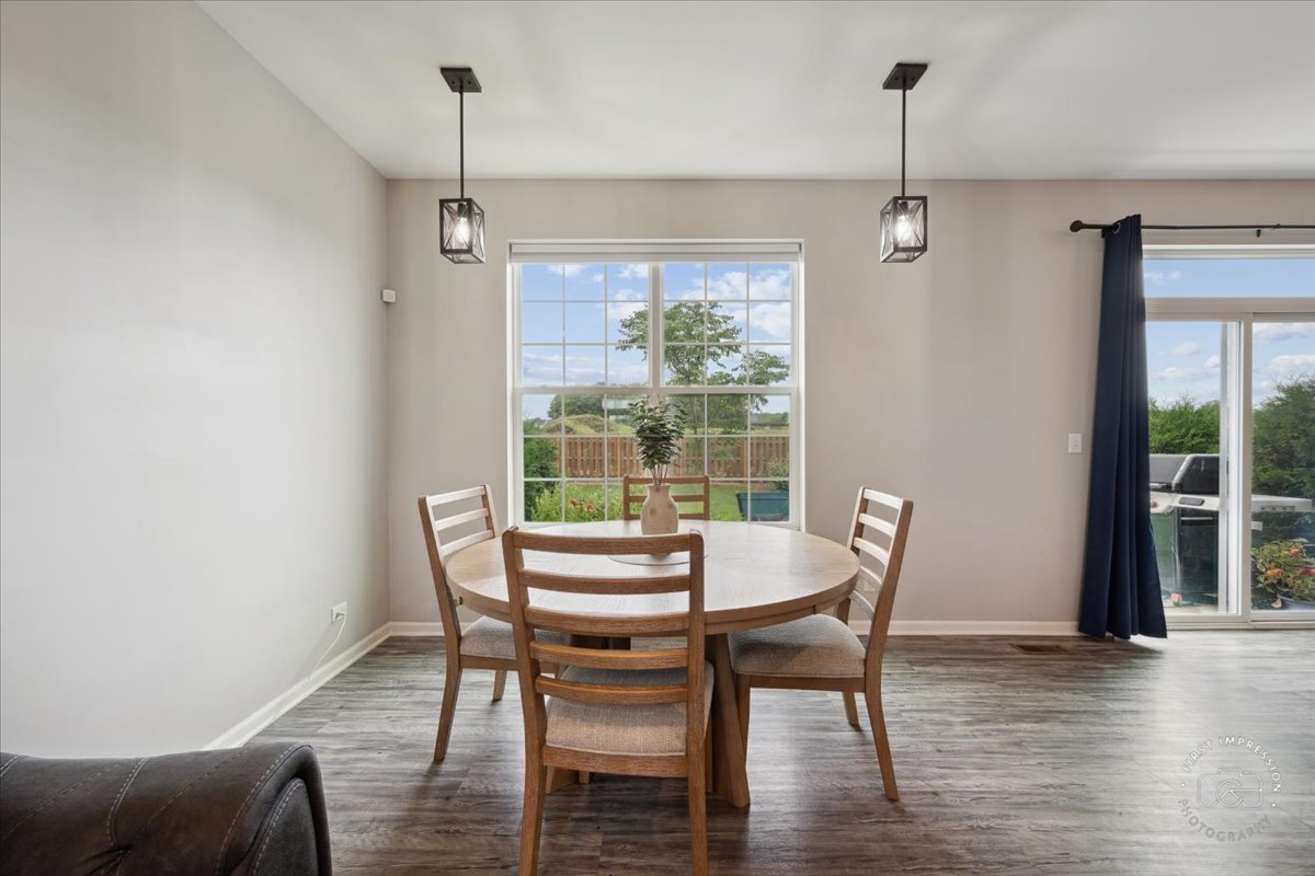 2045 Stuttle Road Batavia, IL 60510 - Photo 6 of 20 a view of a dining room with furniture window and wooden floor