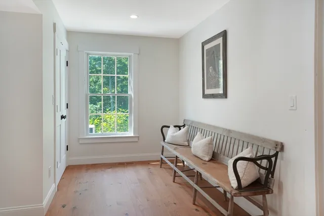a view of a room with windows and lounge chair