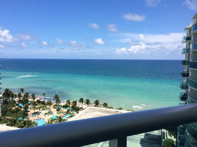 a view of a lake from a balcony