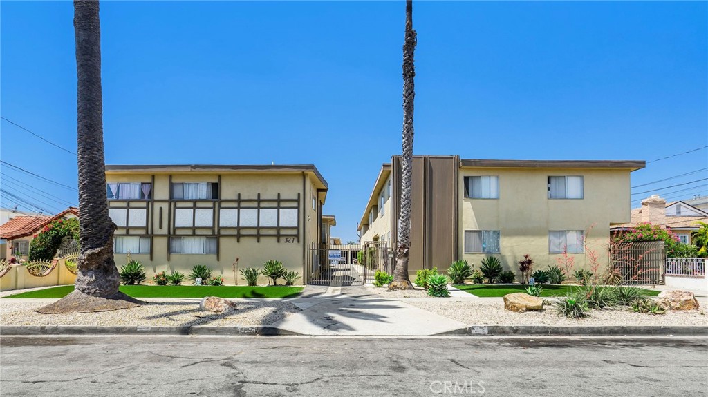 327 Stepney Street Inglewood, CA 90302 - Photo 1 of 13 a front view of multiple houses with a yard