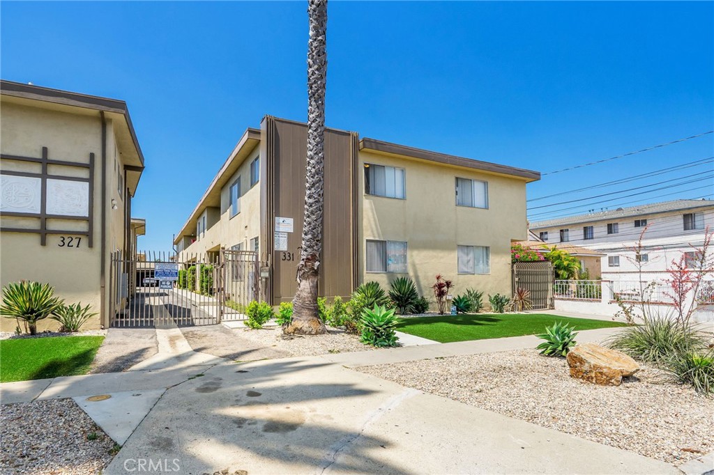 327 Stepney Street Inglewood, CA 90302 - Photo 11 of 13 a front view of a house with a yard