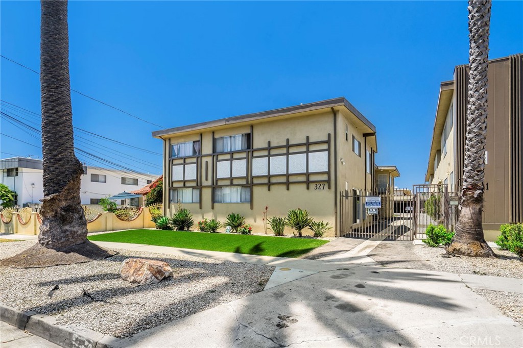 327 Stepney Street Inglewood, CA 90302 - Photo 12 of 13 a front view of a building with garden