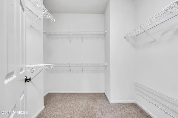 a kitchen with stainless steel appliances granite countertop a stove a sink a refrigerator and cabinets