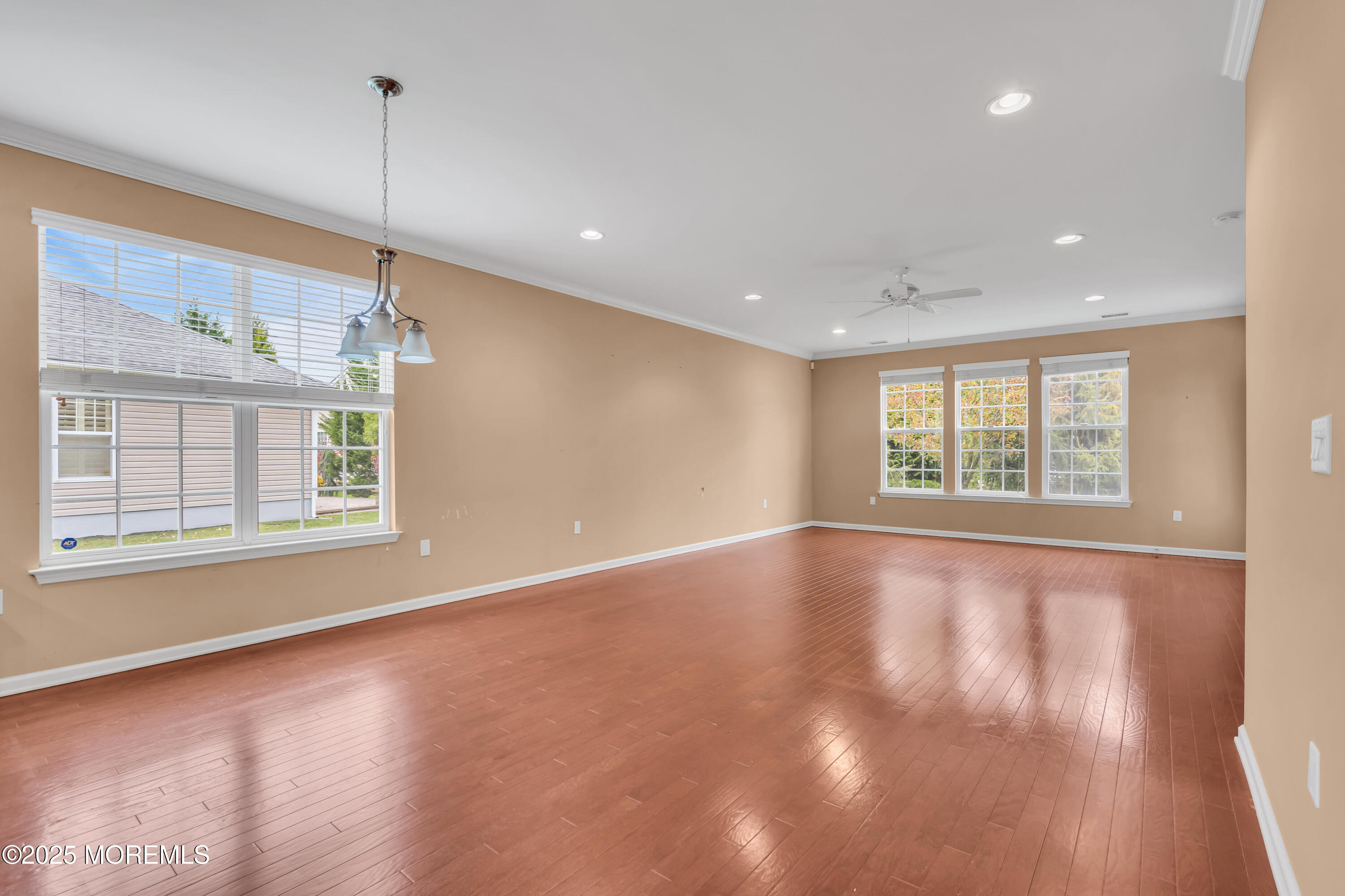 42 Pembroke Drive Jackson, NJ 08527 - Photo 22 of 44 a view of an empty room with wooden floor and a window