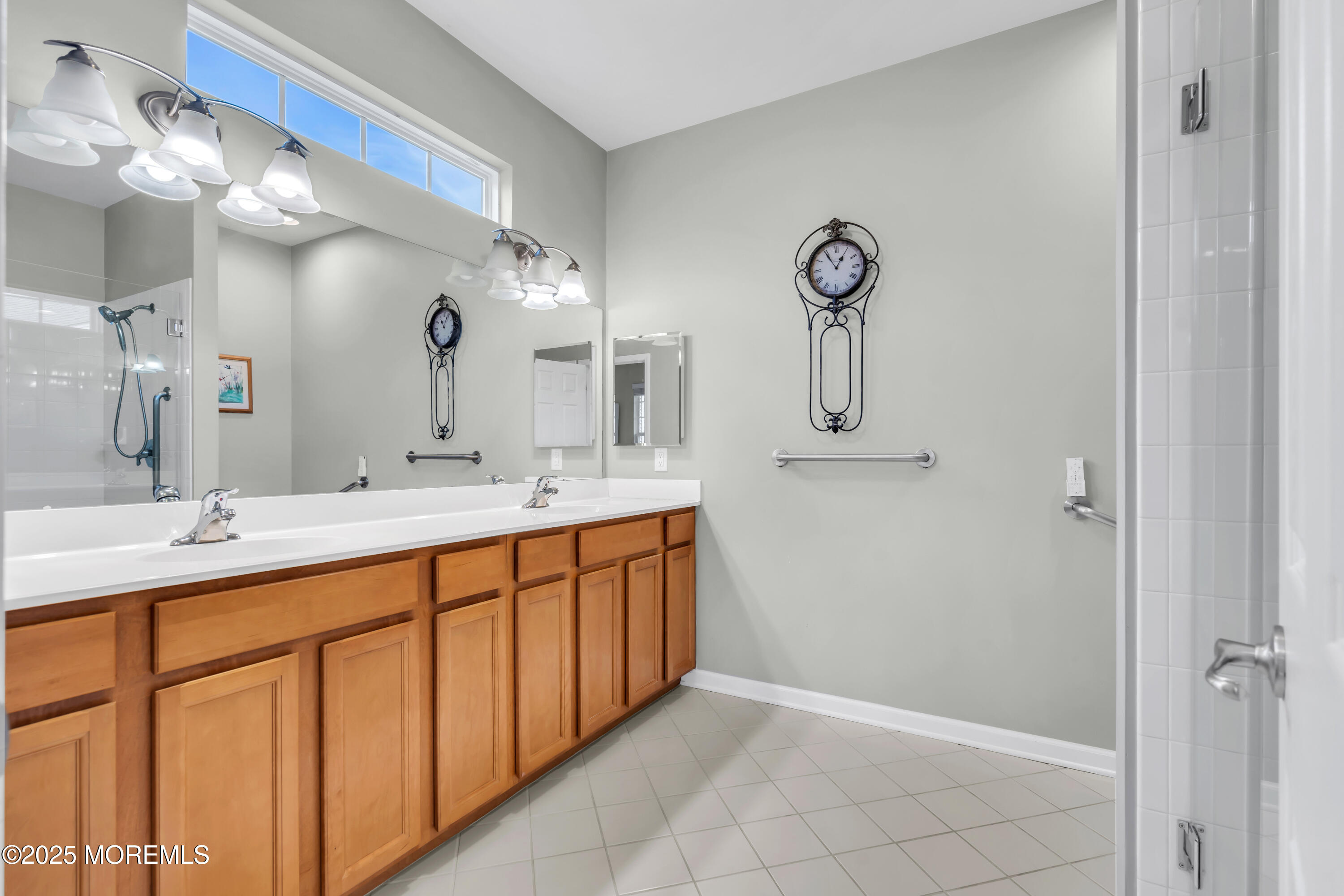 42 Pembroke Drive Jackson, NJ 08527 - Photo 29 of 44 a bathroom with a double vanity sink and a mirror