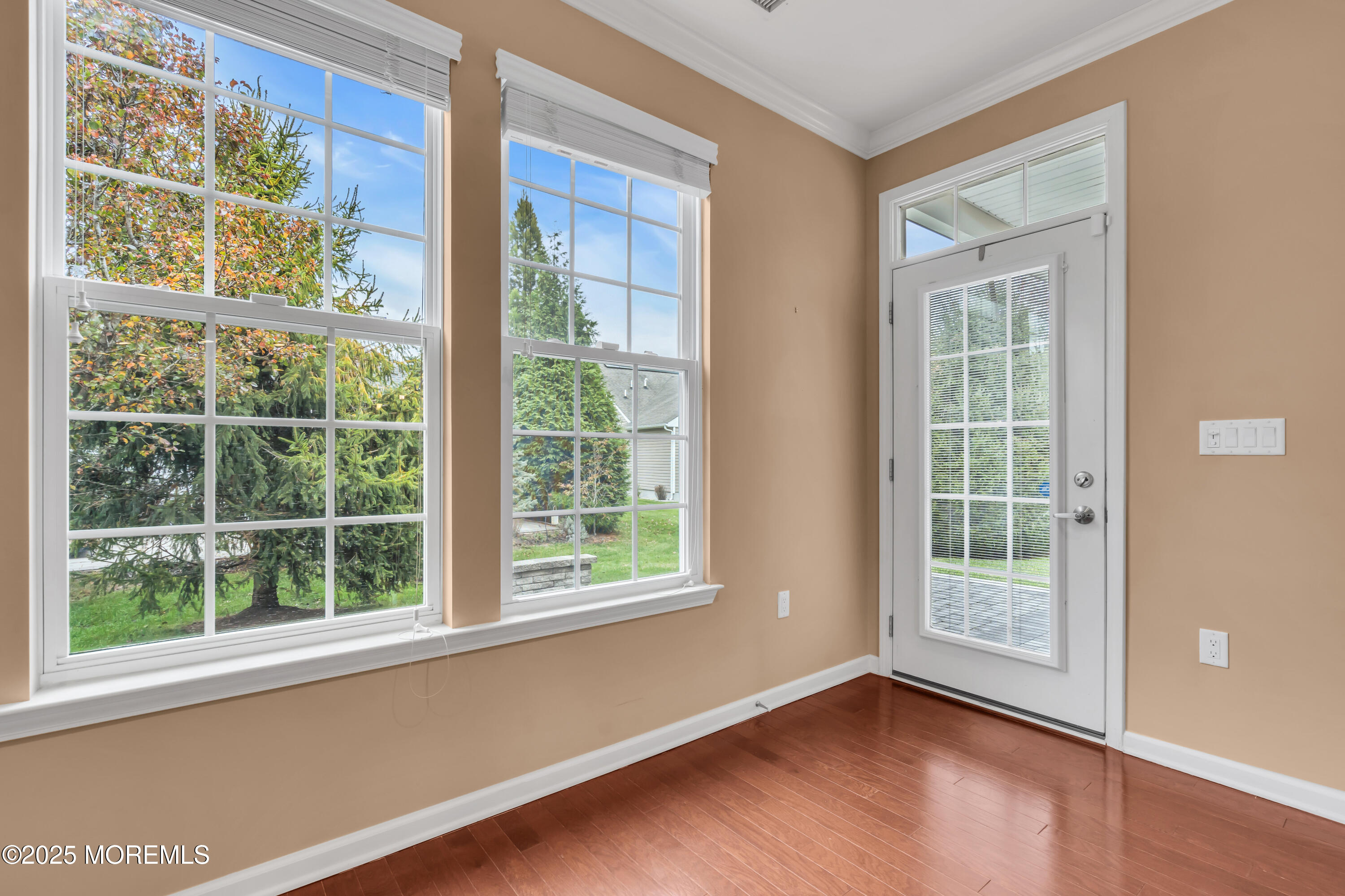 42 Pembroke Drive Jackson, NJ 08527 - Photo 35 of 44 an empty room with wooden floor and windows