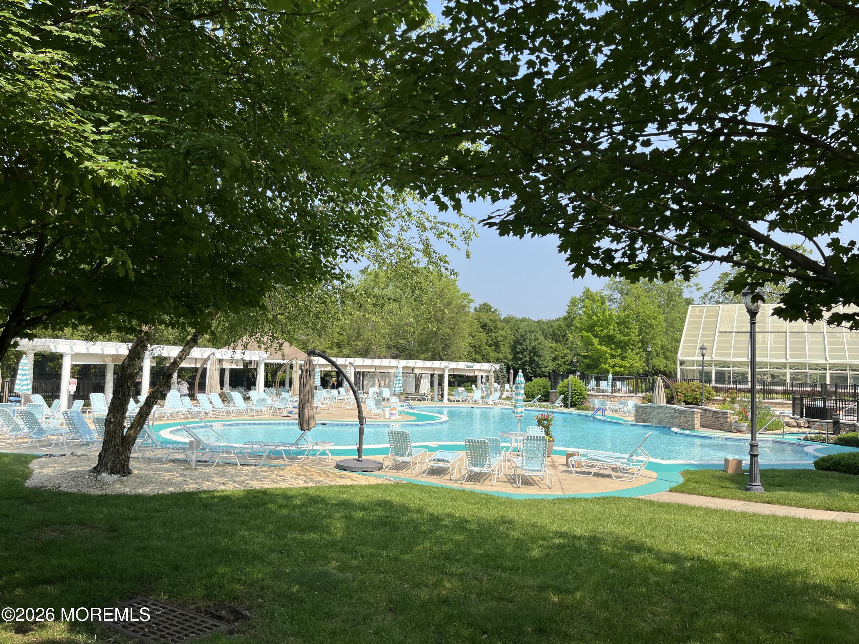 42 Pembroke Drive Jackson, NJ 08527 - Photo 42 of 44 a view of house with swimming pool and sitting area