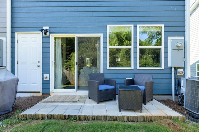 a house view with a sitting space and garden