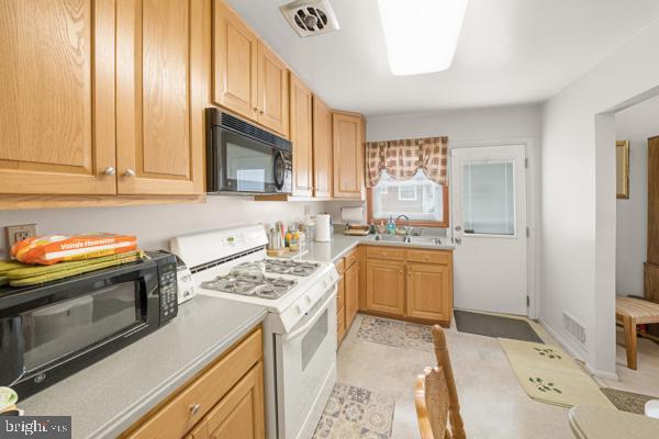 3413 Retlaw Road Baltimore, MD 21207 - Photo 6 of 32 Cozy kitchen with warm wood tones.