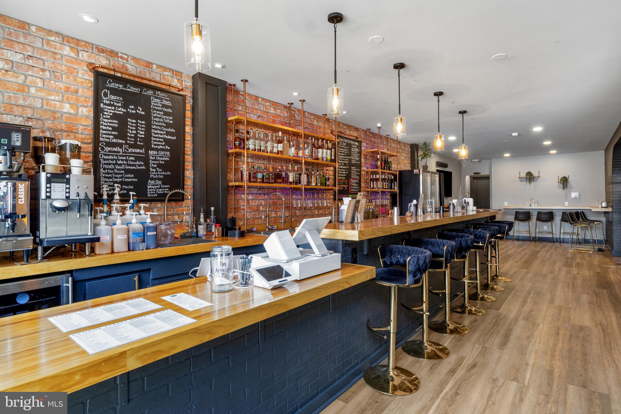 125 North George Street York, PA 17401 - Photo 13 of 56 a large kitchen with a table and chairs