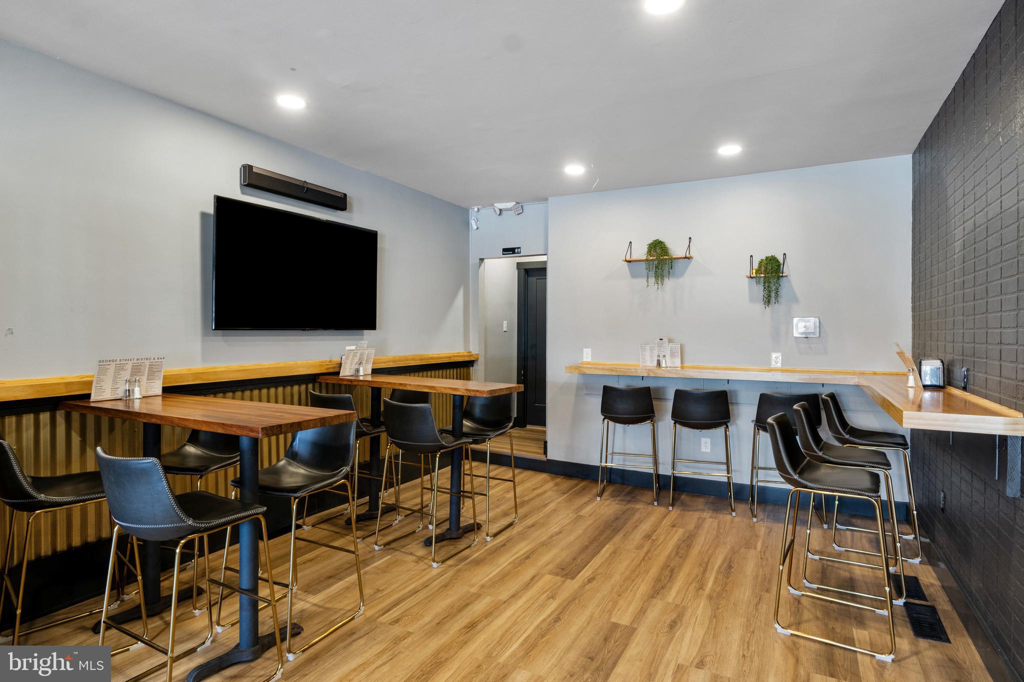 125 North George Street York, PA 17401 - Photo 14 of 56 a view of a livingroom with furniture and a flat screen tv