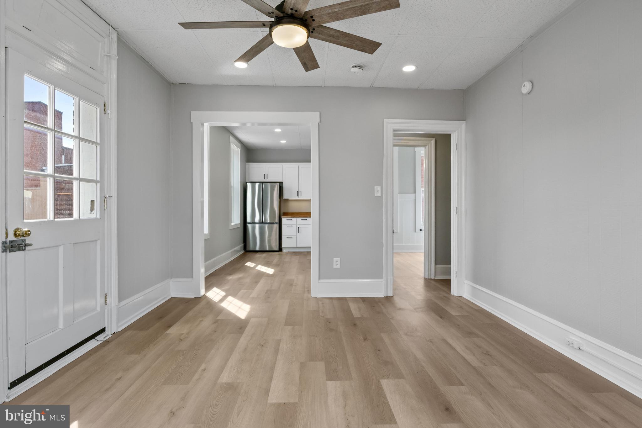 125 North George Street York, PA 17401 - Photo 16 of 56 wooden floor in an empty room with a window