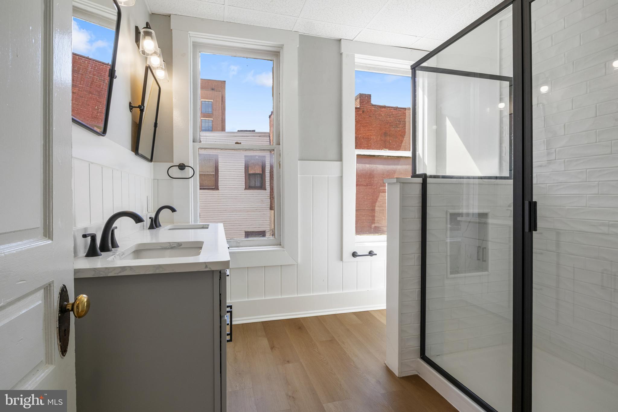 125 North George Street York, PA 17401 - Photo 26 of 56 a bathroom with a sink and mirror