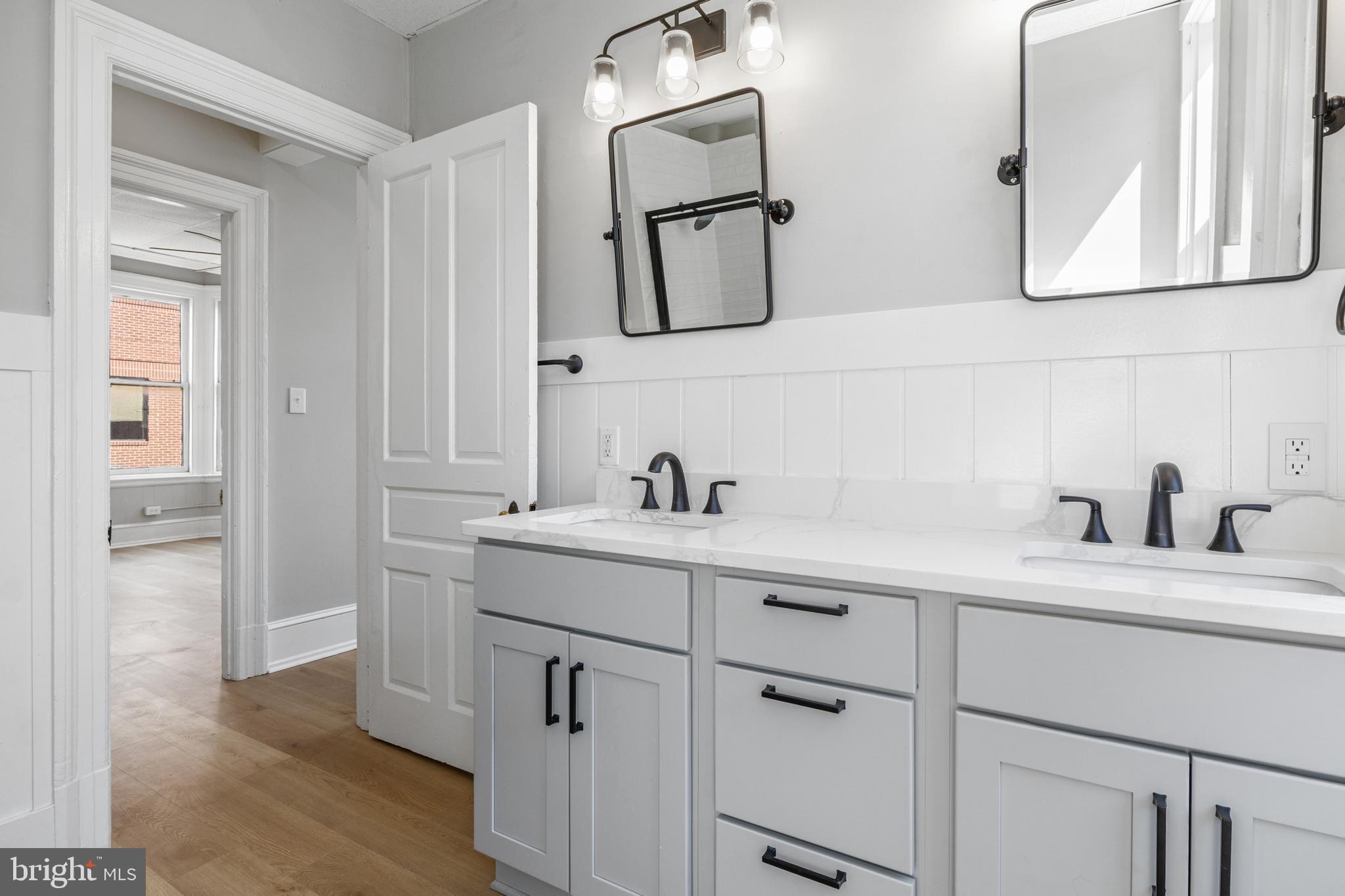 125 North George Street York, PA 17401 - Photo 27 of 56 a bathroom with a sink and a mirror