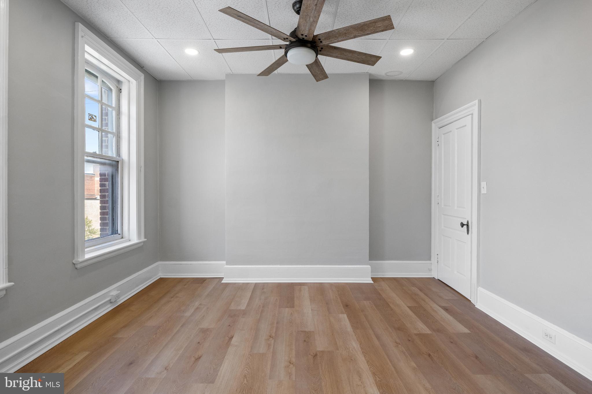 125 North George Street York, PA 17401 - Photo 30 of 56 wooden floor in an empty room with a window