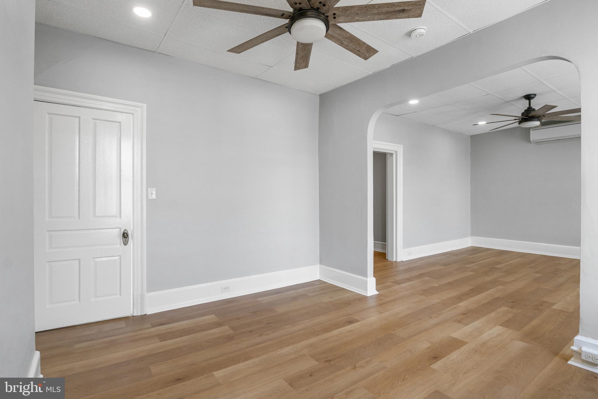 125 North George Street York, PA 17401 - Photo 31 of 56 a view of a livingroom with a ceiling fan wooden floor and ceiling fan