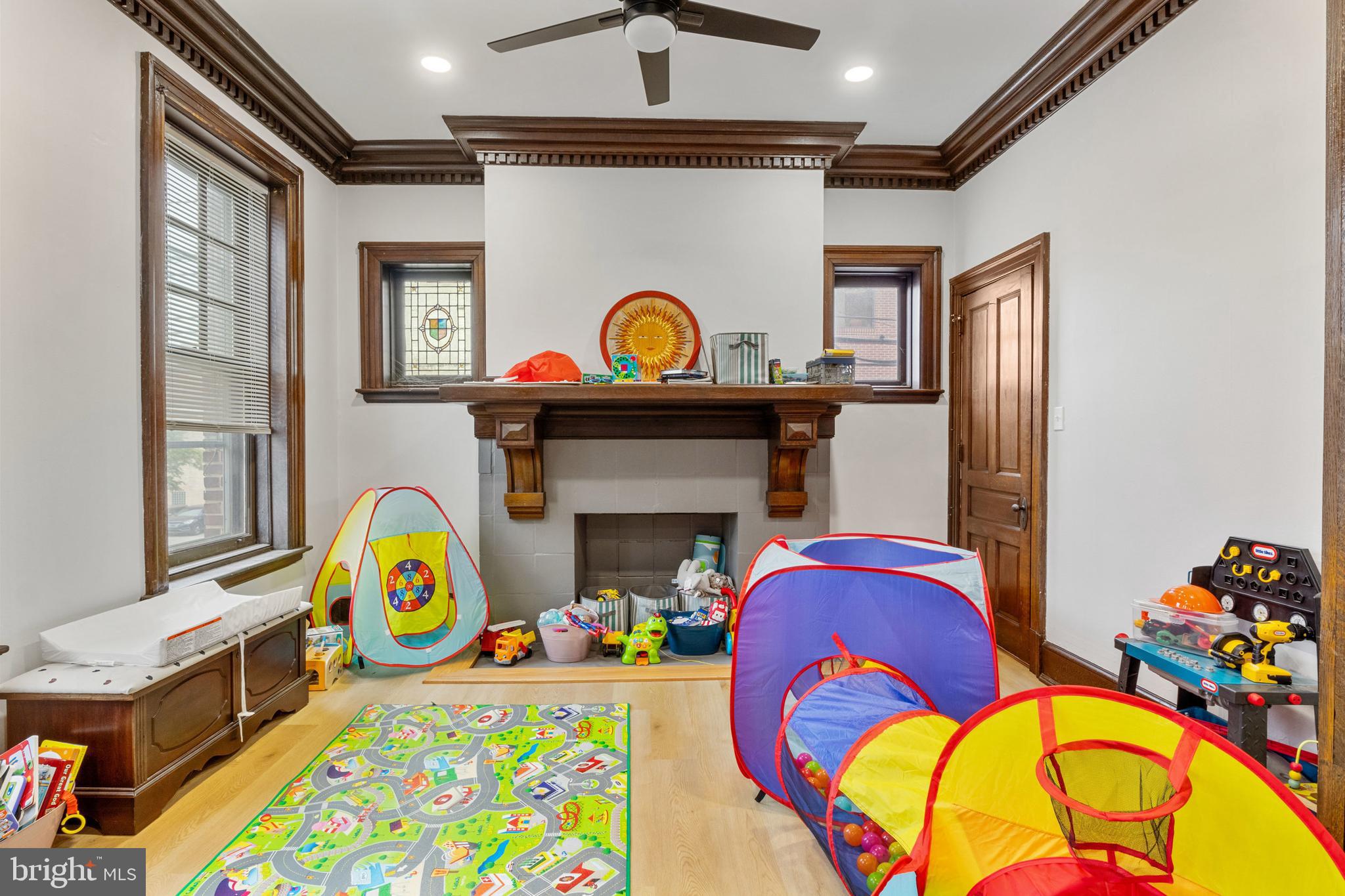 125 North George Street York, PA 17401 - Photo 43 of 56 a living room with fireplace furniture and a window