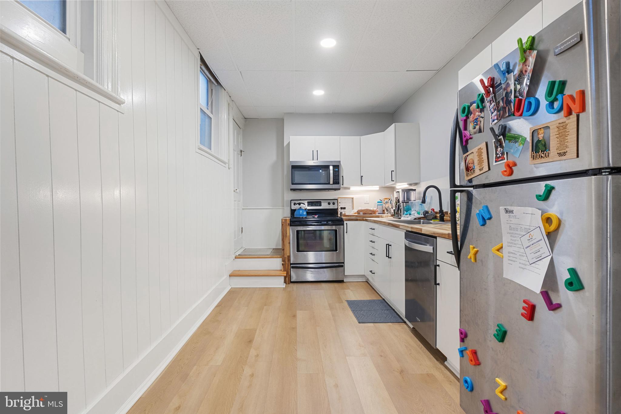 125 North George Street York, PA 17401 - Photo 47 of 56 a kitchen with stainless steel appliances granite countertop a refrigerator and a stove top oven